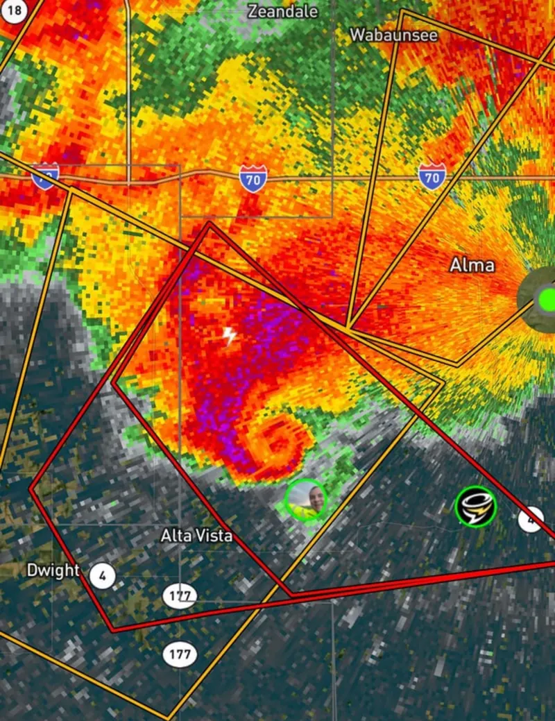 A radar picture with a curl of colour wrapping round the back of a storm, like a hook